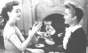 Bette Davis & Ann Baxter show the wrongs and rights of coupe champagne glass holding in ‘All About Eve’ 1950